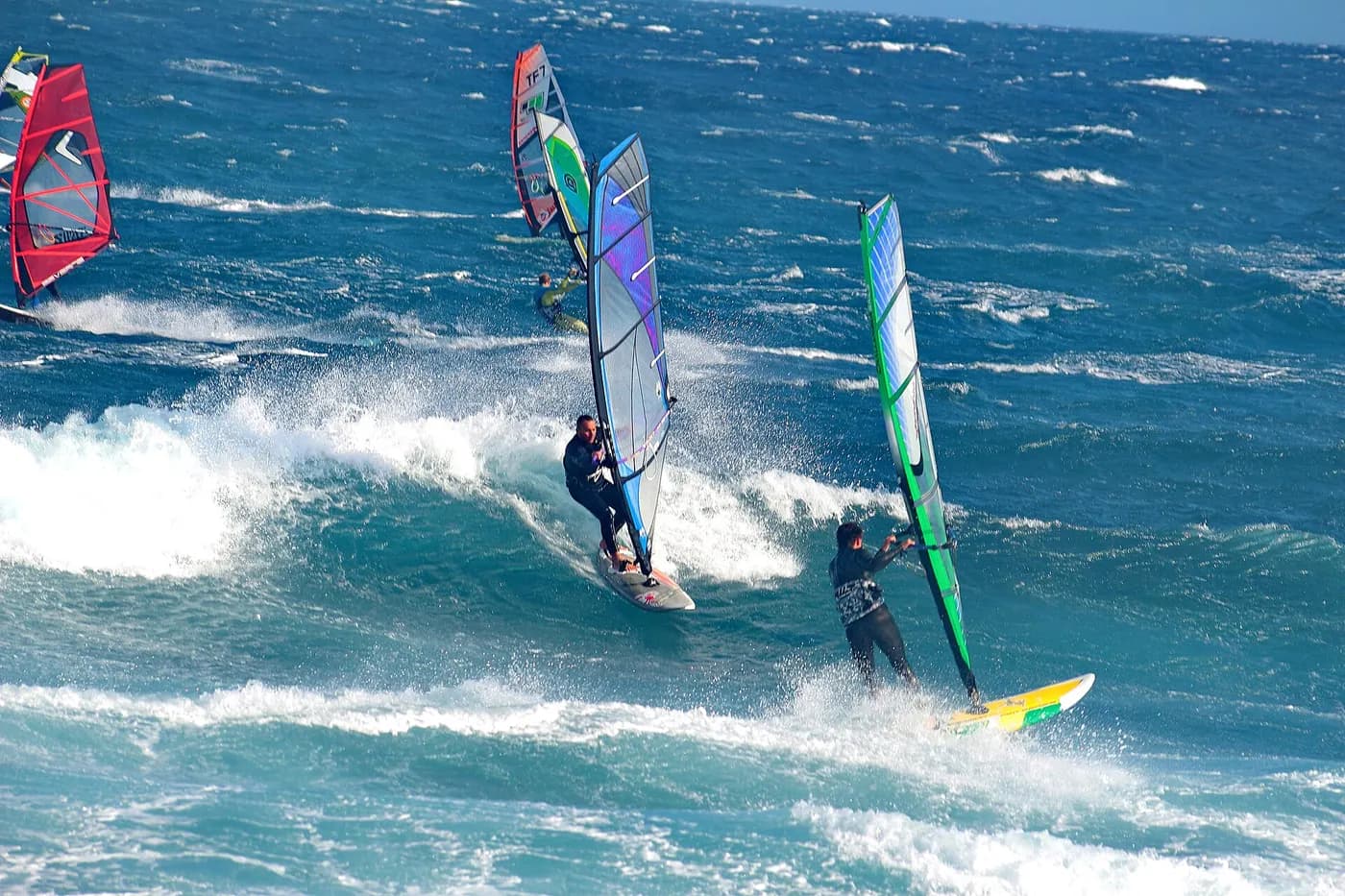 Windsurfer in textured, gusty water